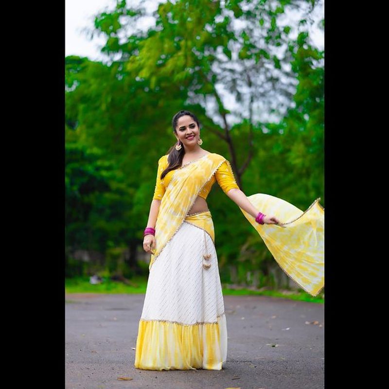 Tollywood Anchor Anasuya hot look in yellow half saree