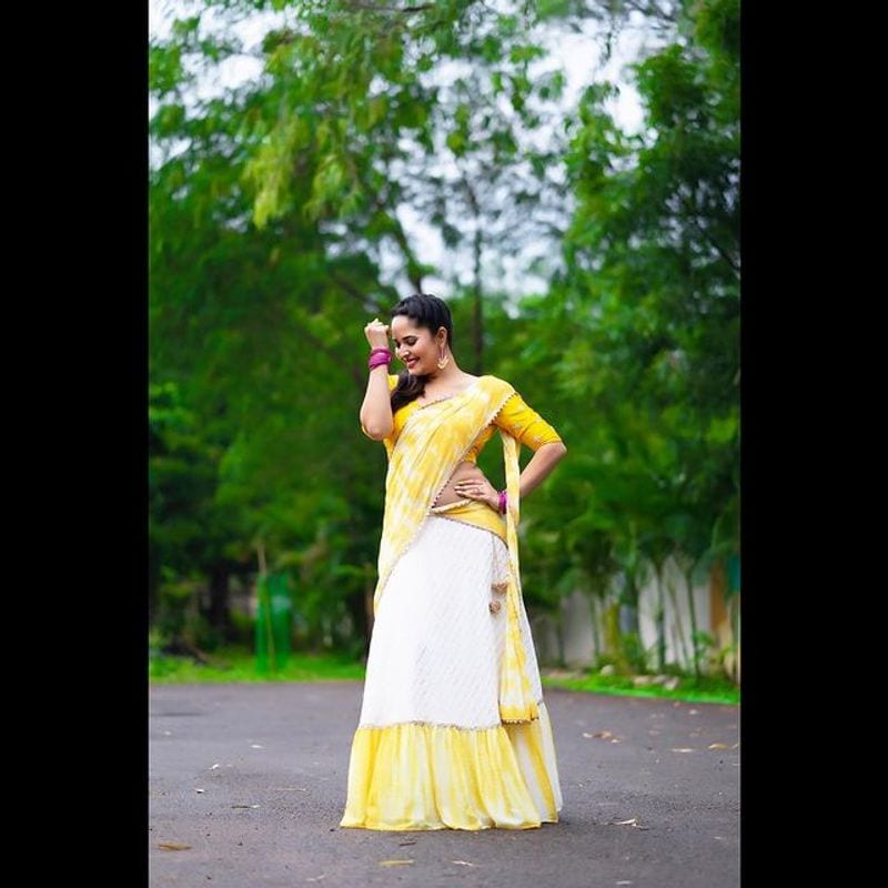 Tollywood Anchor Anasuya hot look in yellow half saree