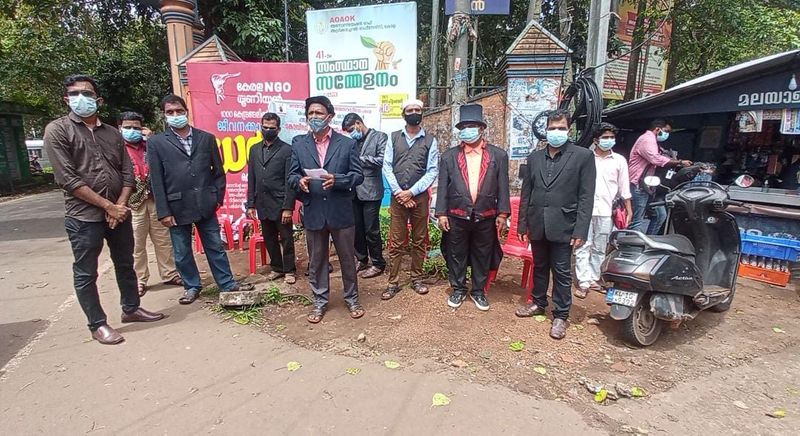Magicians protest by burning tea on the head