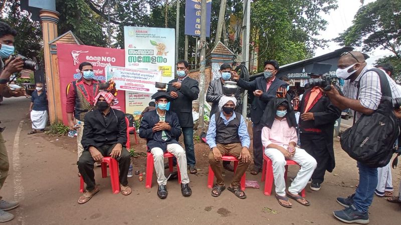 Magicians protest by burning tea on the head
