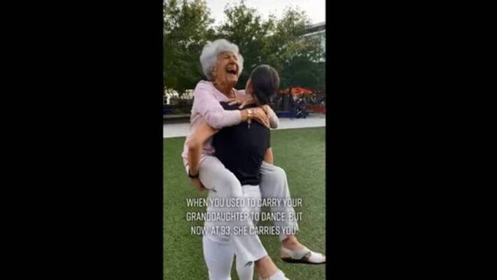woman carrying grandma and dances woman carrying grandma and dances