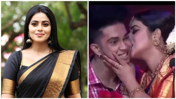 ActressPoorna Kissed And Bites Contesant Cheek video goes viral ActressPoorna Kissed And Bites Contesant Cheek video goes viral