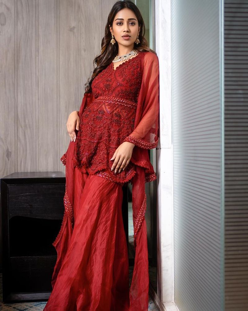 nivetha pethuraj raise the tempreture for hot red dress latest photos