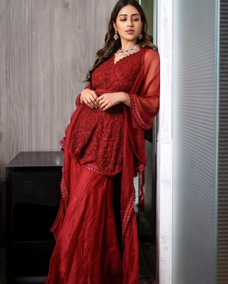 nivetha pethuraj raise the tempreture for hot red dress latest photos