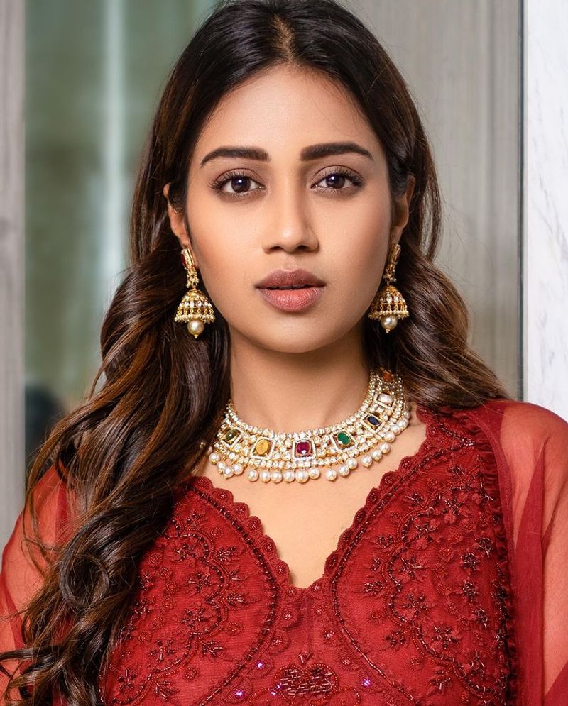 nivetha pethuraj raise the tempreture for hot red dress latest photos