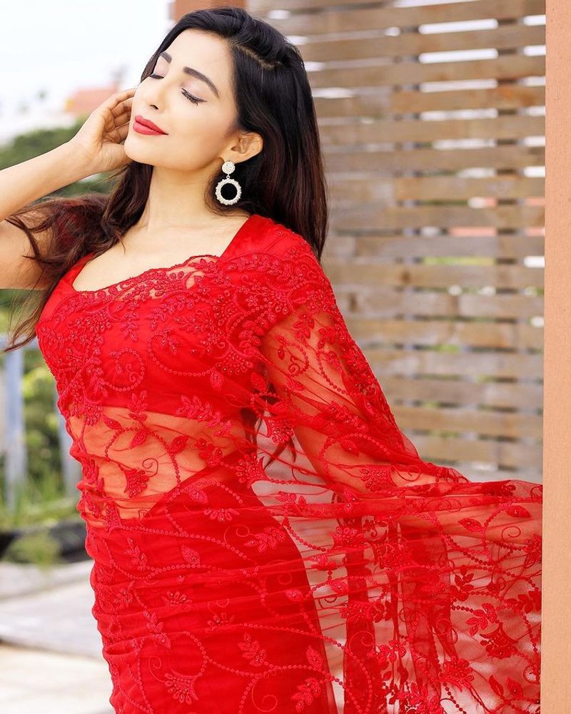 actress parvathy nair over load hot red saree photo shoot
