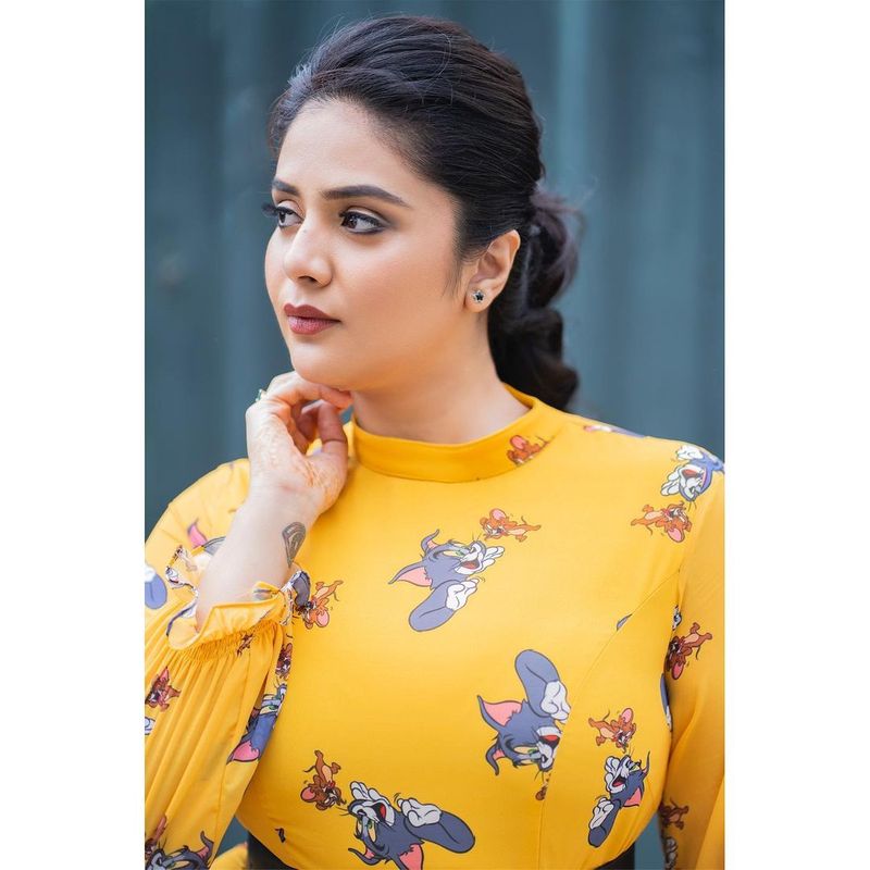 hot anchor sreemukhi grabs attention her latest photo shoot in short frack getting viral