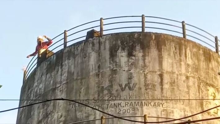 man suicide threat top of water tank man suicide threat top of water tank