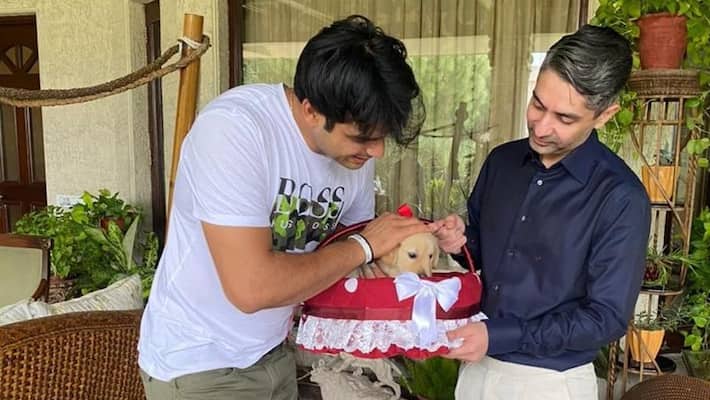 Indian Golden man Neeraj Chopra receives a cub named Tokyo from first Indian gold medalist Abhinav Bindra Indian Golden man Neeraj Chopra receives a cub named Tokyo from first Indian gold medalist Abhinav Bindra