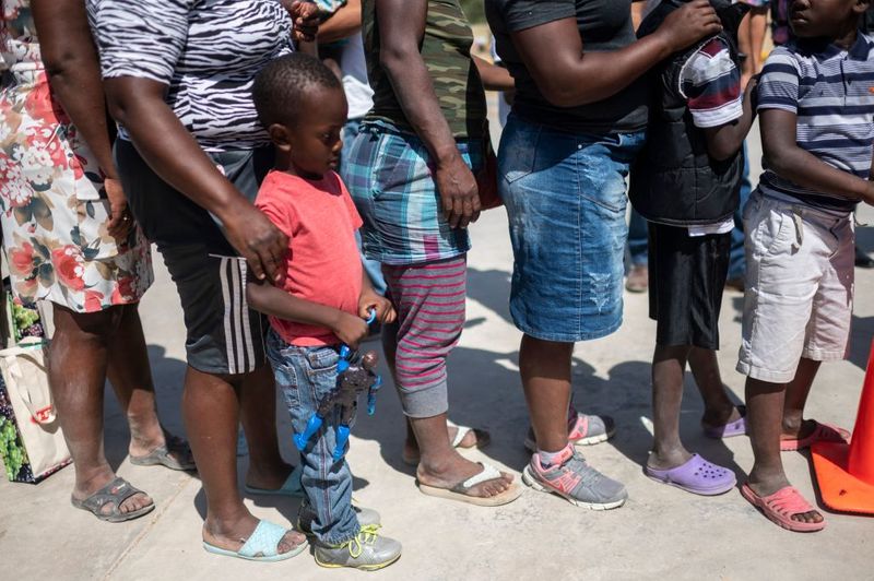 Shocking images of horse mounted US police officers whipping Haitian migrants on US Mexico border