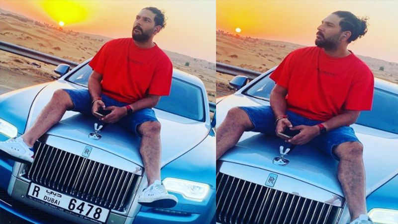 Yuvraj Singh Enjoys Sunset listening Music on Top of Rolls Royce Bonnet, See Pics