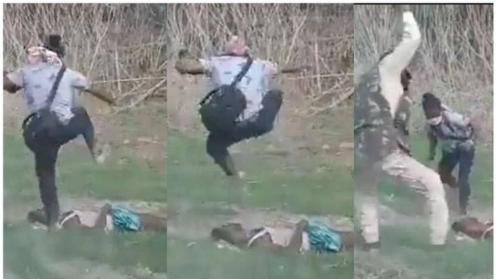 Assam firing: official photographer hitting dead man Assam firing: official photographer hitting dead man