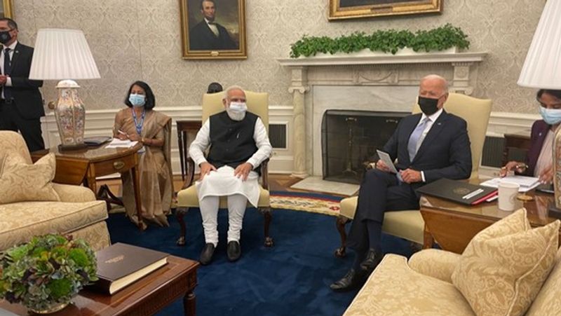 pm modi and joe biden before the meeting women outside white house slogans of modi modi