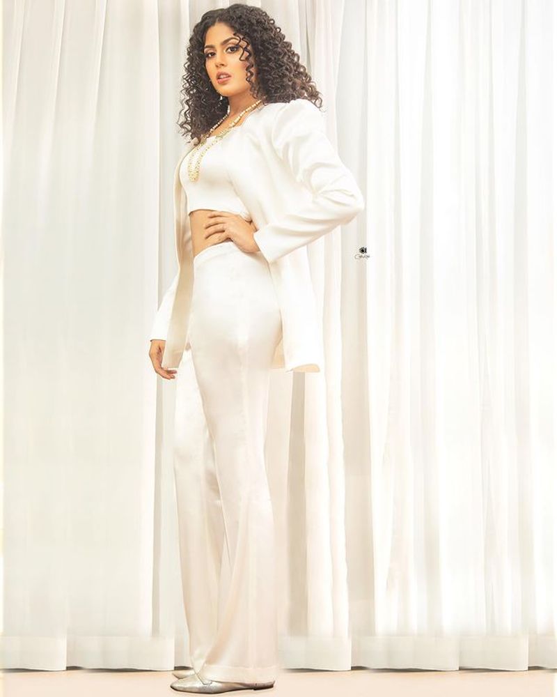 jathi ratnalu actress Faria Abdullah stunning poses in white dress