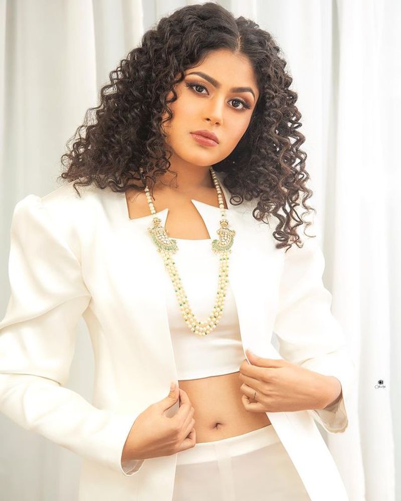 jathi ratnalu actress Faria Abdullah stunning poses in white dress