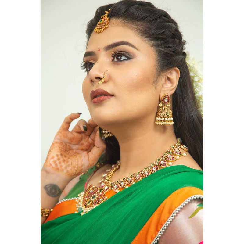 anchor sreemukhi stuns in half saree but hotness never misses