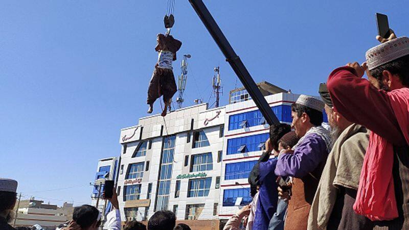 Taliban shot and hanged the body from a crane in Afghanistan
