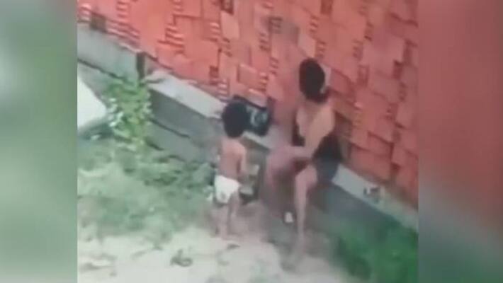 mom protecting child from collapsing wall mom protecting child from collapsing wall
