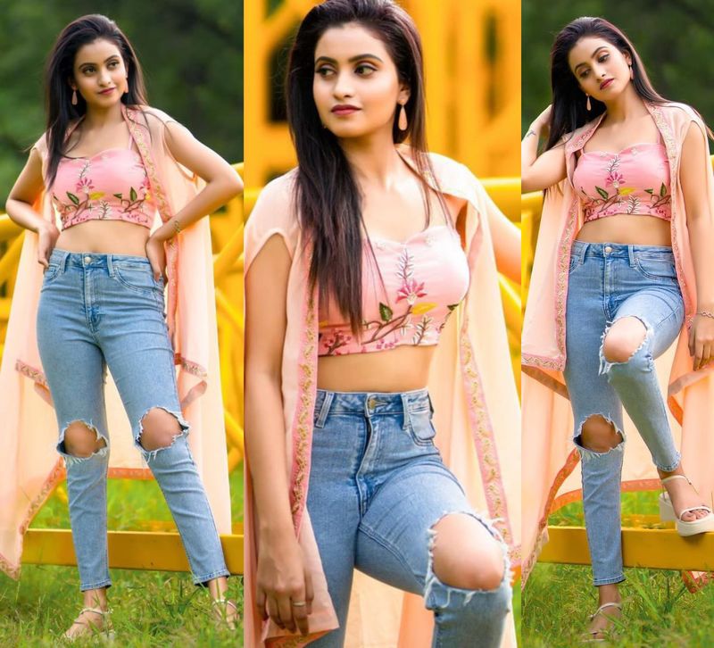 young anchor deepika pilli jaw dropping poses goes viral she stuns in torn jeans trendy top