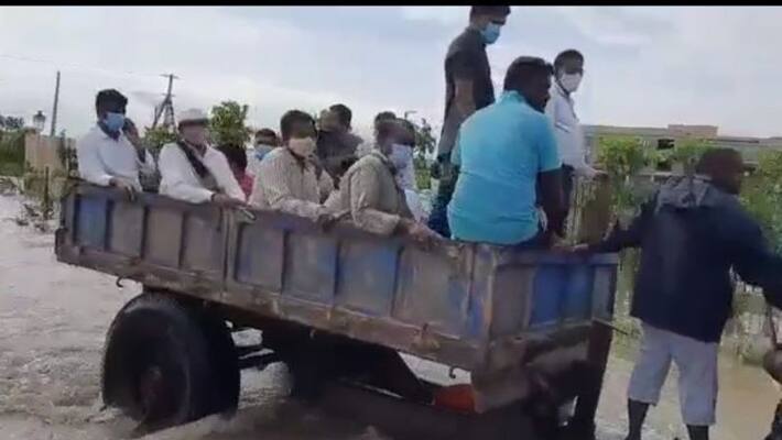 Cyclone Gulab... Sircilla Collector Anurag Jayant Stuck In Flood Water Cyclone Gulab... Sircilla Collector Anurag Jayant Stuck In Flood Water