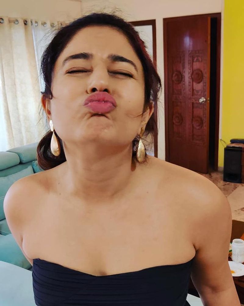 Actress Poonam Bajwa showing full legs in a black bikini hot photos