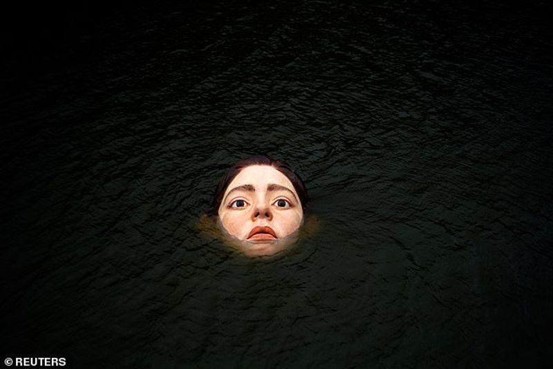 Sculpture of a girl drowning in the Bilbao River Controversial
