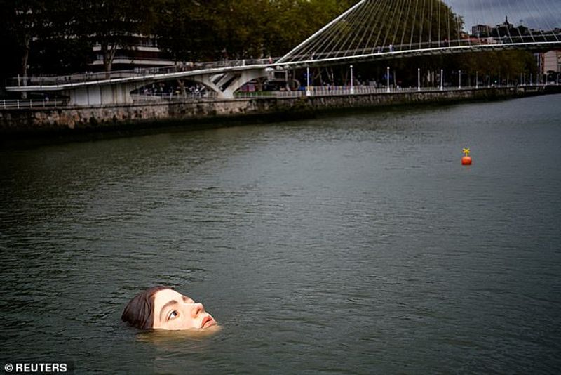 Sculpture of a girl drowning in the Bilbao River Controversial