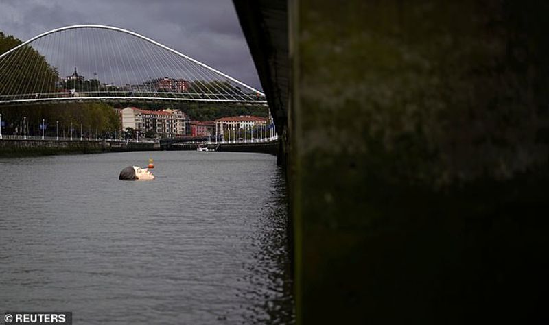 Sculpture of a girl drowning in the Bilbao River Controversial