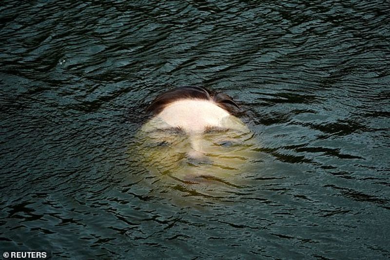 Sculpture of a girl drowning in the Bilbao River Controversial