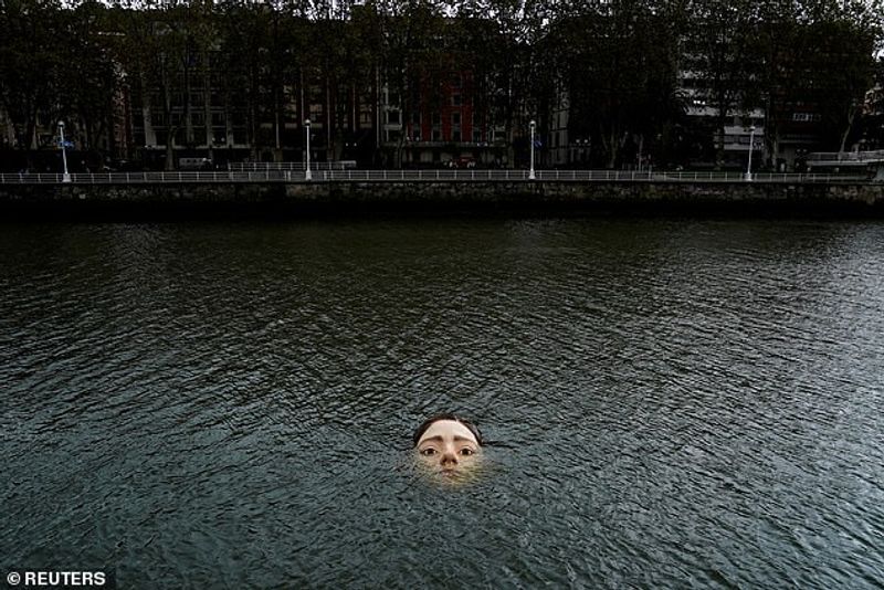 Sculpture of a girl drowning in the Bilbao River Controversial