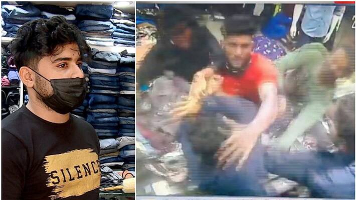 Youths attacked ready made shop sales man near Kannur railway station Youths attacked ready made shop sales man near Kannur railway station
