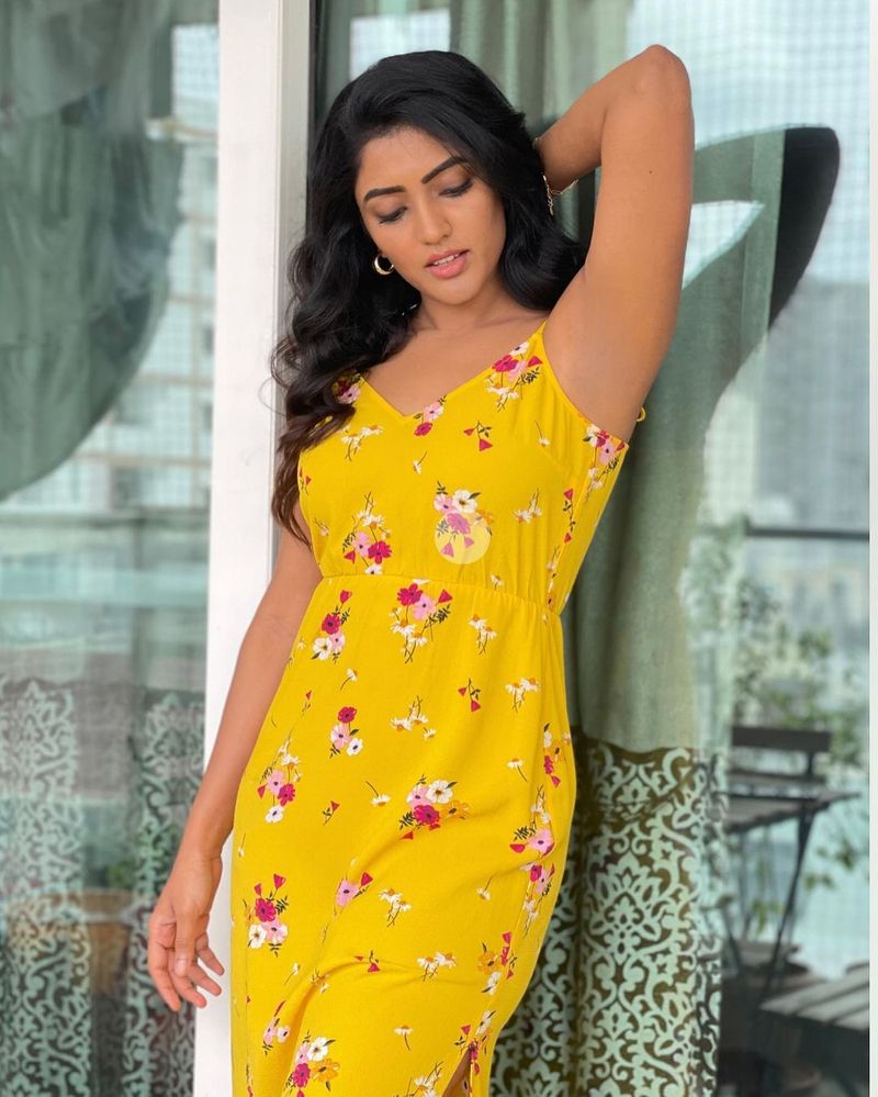 eesha rebba hot poses in sleeve less yellow night wear pics goes viral