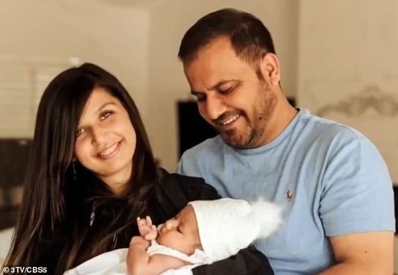 iconic photo baby lifted over wall at Kabul airport by Marine