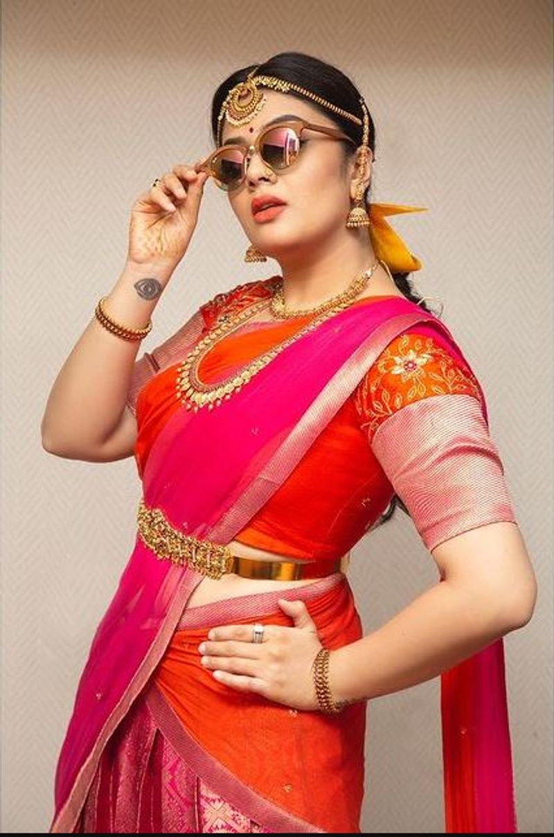 Sreemukhi Stylish photos in half saree, crazy looks in goggles