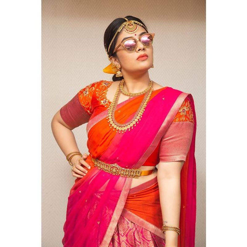 Sreemukhi Stylish photos in half saree, crazy looks in goggles