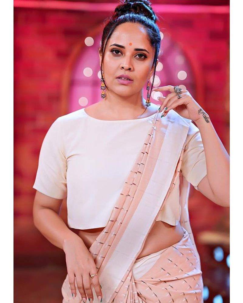 Anchor Anasuya hot show in latest saree photoshoot