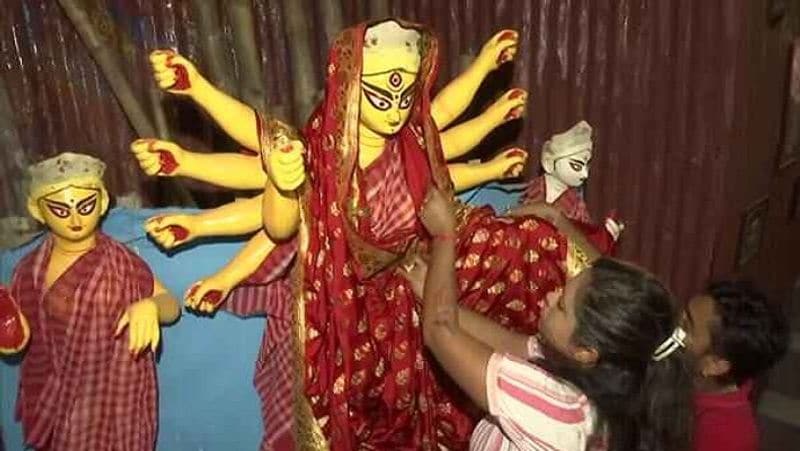 Goddess is dressed in a 16 kg gold sari at Mahalaxmi temple in Pune and Sindoor Khela festival is celebrated in Bengal