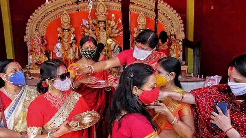 Goddess is dressed in a 16 kg gold sari at Mahalaxmi temple in Pune and Sindoor Khela festival is celebrated in Bengal
