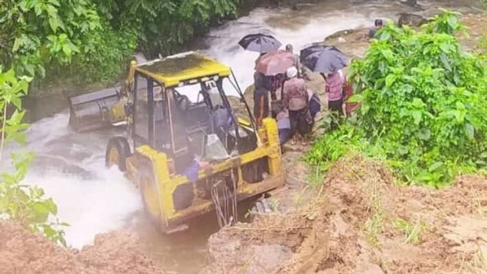 During road construction in Idukki, a bulldozer overturned into a river During road construction in Idukki, a bulldozer overturned into a river