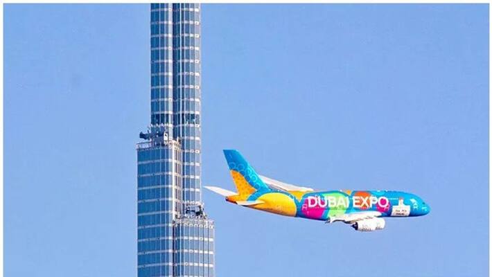 expo special Emirates A380 makes low flypast of Burj Khalifa expo special Emirates A380 makes low flypast of Burj Khalifa