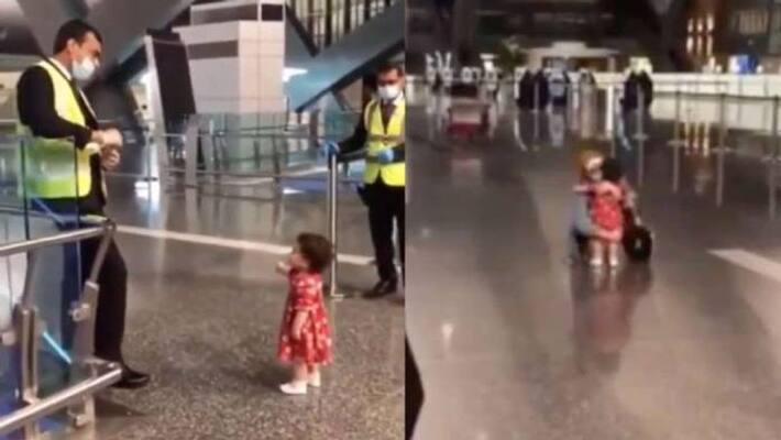 little girl asking permission from airport officers to hug aunt little girl asking permission from airport officers to hug aunt