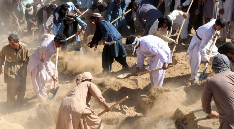 mass funeral held for suicide bomb victimes in afghanistan