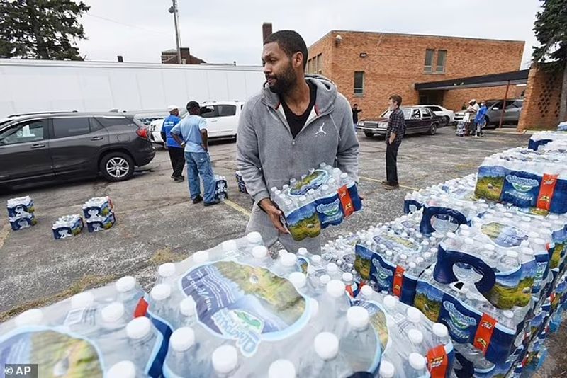 Authorities warn against drinking contaminated water people straggling for water in America