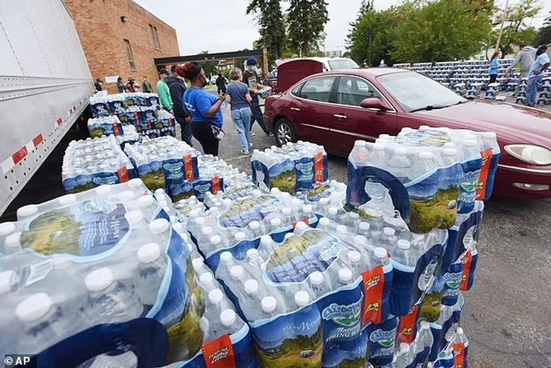 Authorities warn against drinking contaminated water people straggling for water in America