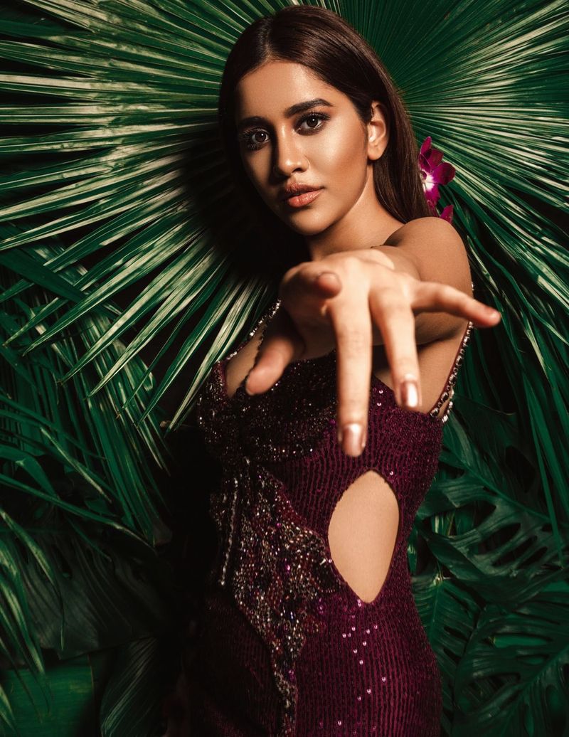 nabha natesh goes bold in purple color trendy wear showcasing her curves