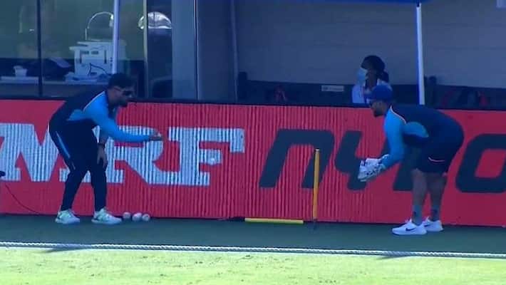 T20 World Cup 2021: MS Dhoni giving keeping drills to Rishabh Pant during India-Australia warm-up match T20 World Cup 2021: MS Dhoni giving keeping drills to Rishabh Pant during India-Australia warm-up match