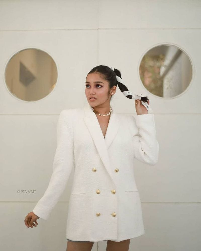 Actor Ajith Reel daughter anikha surendran latest white coat hot photos
