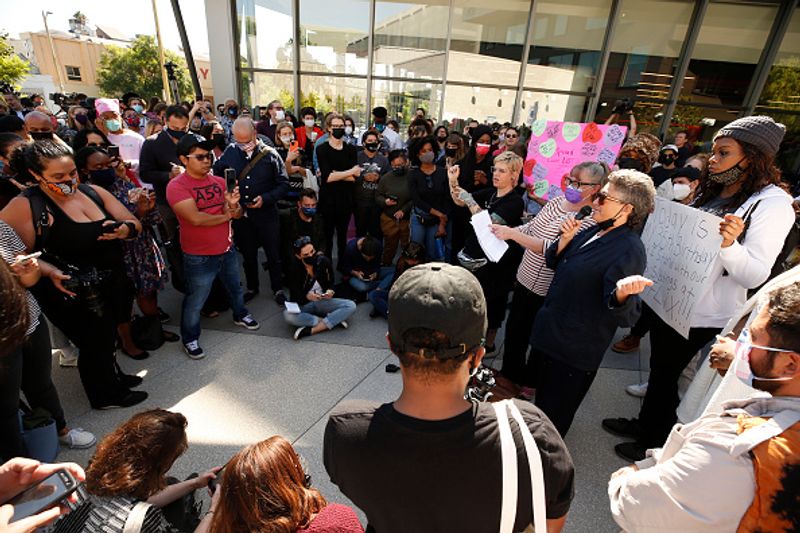 netflix workers protest against comedian dave chappelles transgender comments in his show the closer