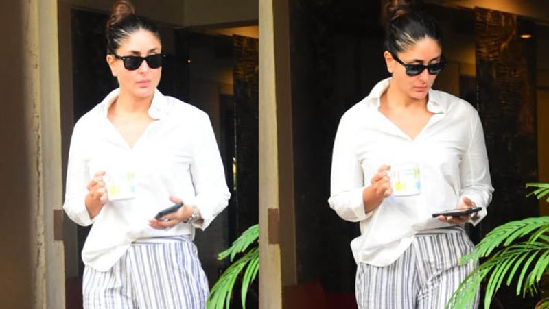 kareena kapoor spotted in untidy hair wearing shirt and striped pants outside home