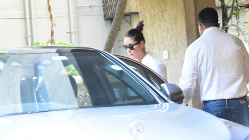 kareena kapoor spotted in untidy hair wearing shirt and striped pants outside home